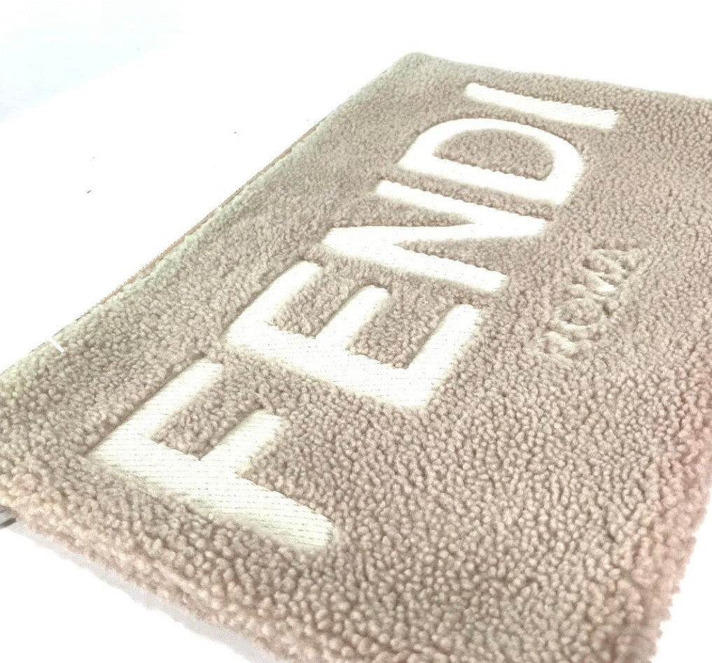 Fendi Mouton Logo Boa Clutch Pouch Beige Shearling – Previously Owned Authentic