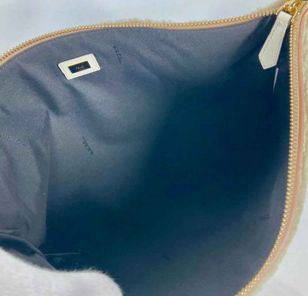 Fendi Mouton Logo Boa Clutch Pouch Beige Shearling – Previously Owned Authentic