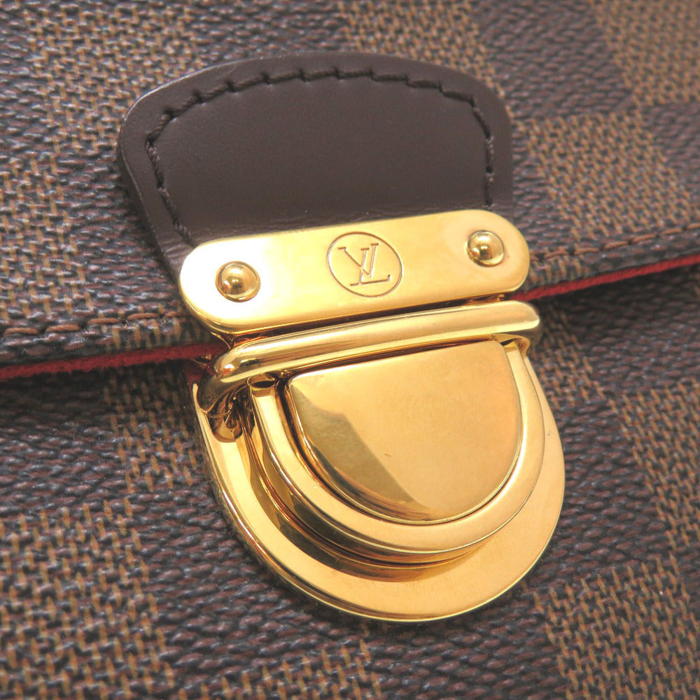 LOUIS VUITTON – Ravello PM Clutch Damier Ebene canvas with brown leather trim and gold-tone hardware