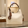 Louis Vuitton Carmel Hobo Mahina Leather Creme Off-White Shoulder Bag Pristine Condition Previously Owned Authentic