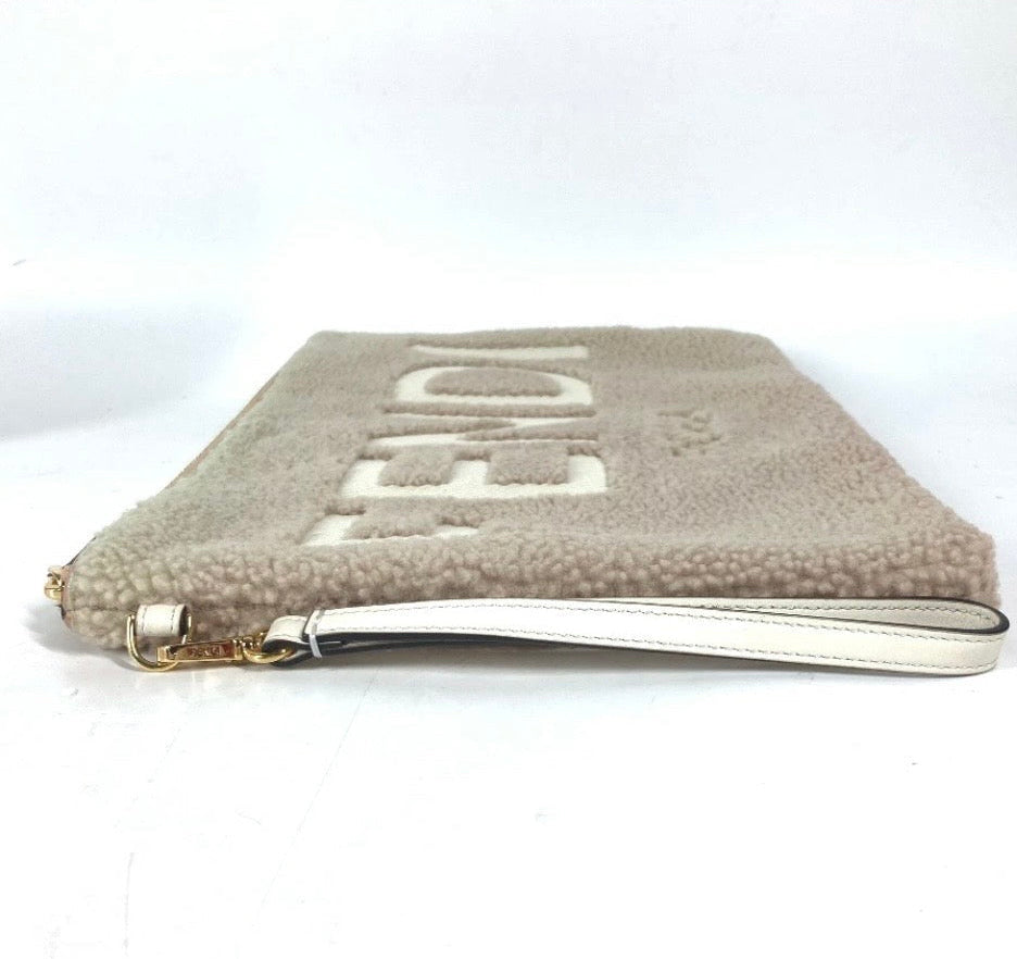 Fendi Mouton Logo Boa Clutch Pouch Beige Shearling – Previously Owned Authentic