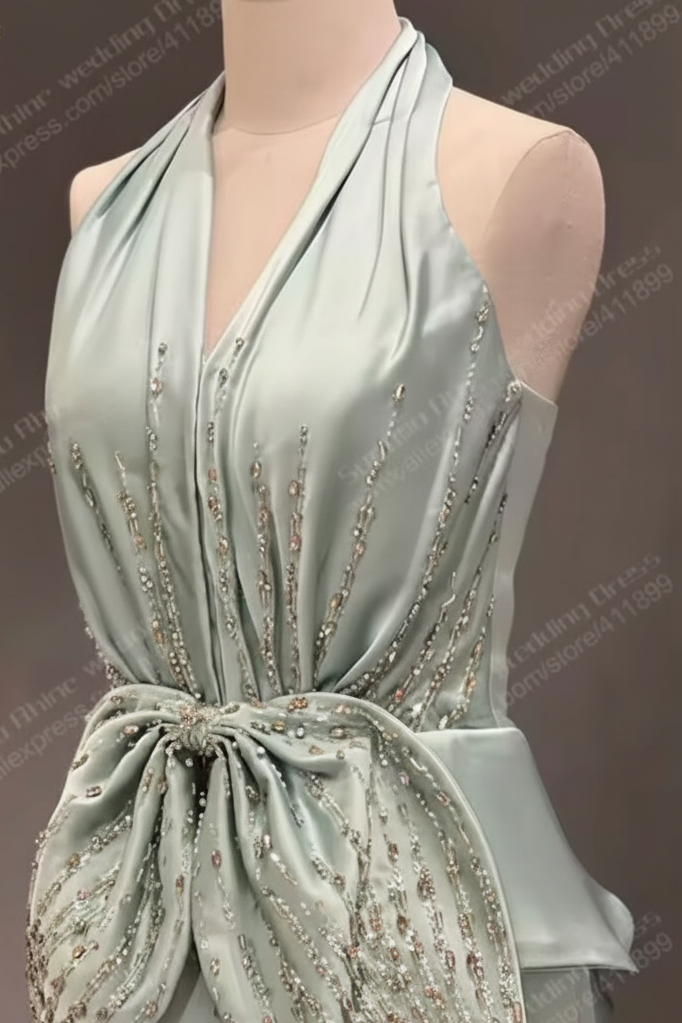 A Pale Mint Green Halter Evening Gown with Crystal-Style Waist Detail Formal Dress