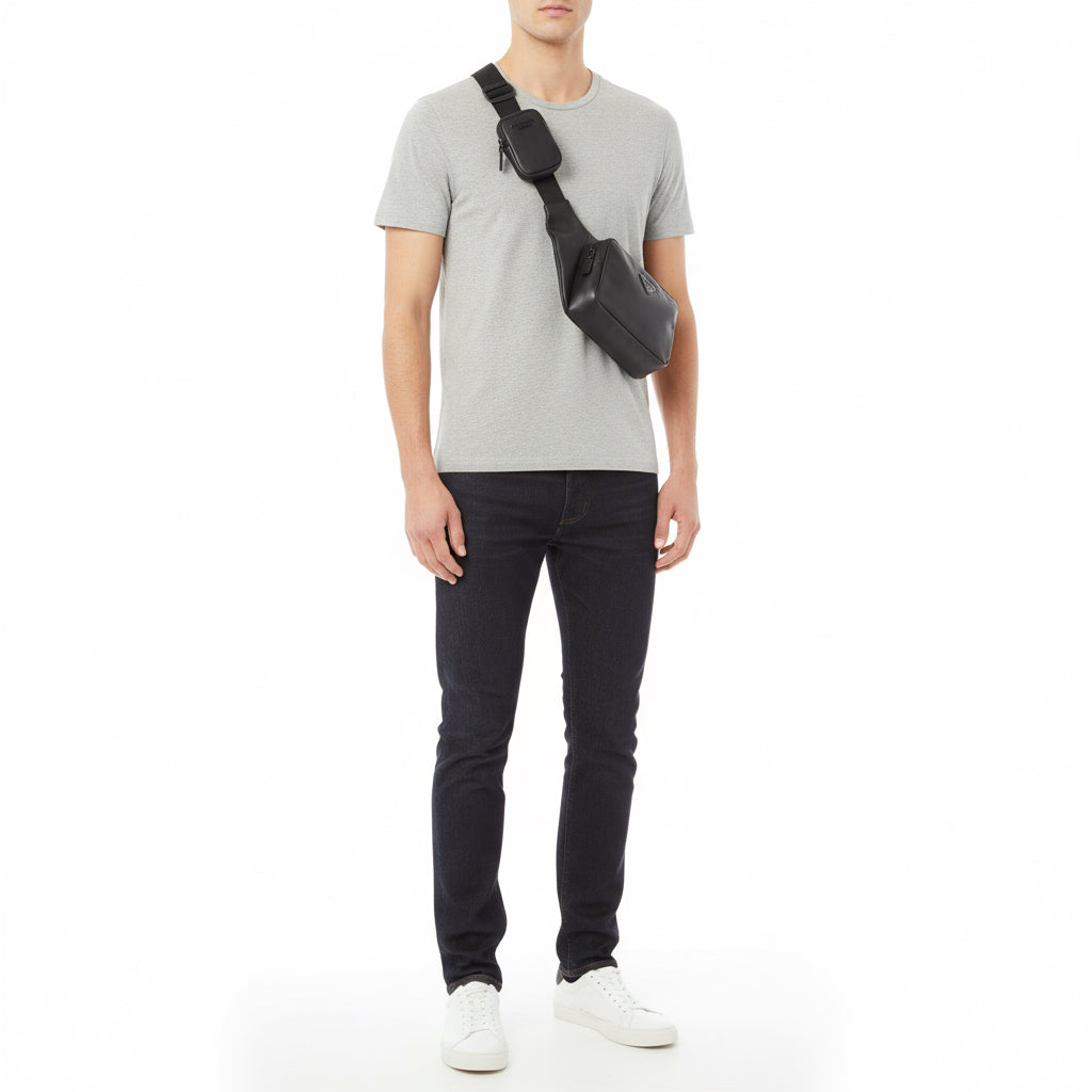 Black shoulder bag on a mannequin against a white background
