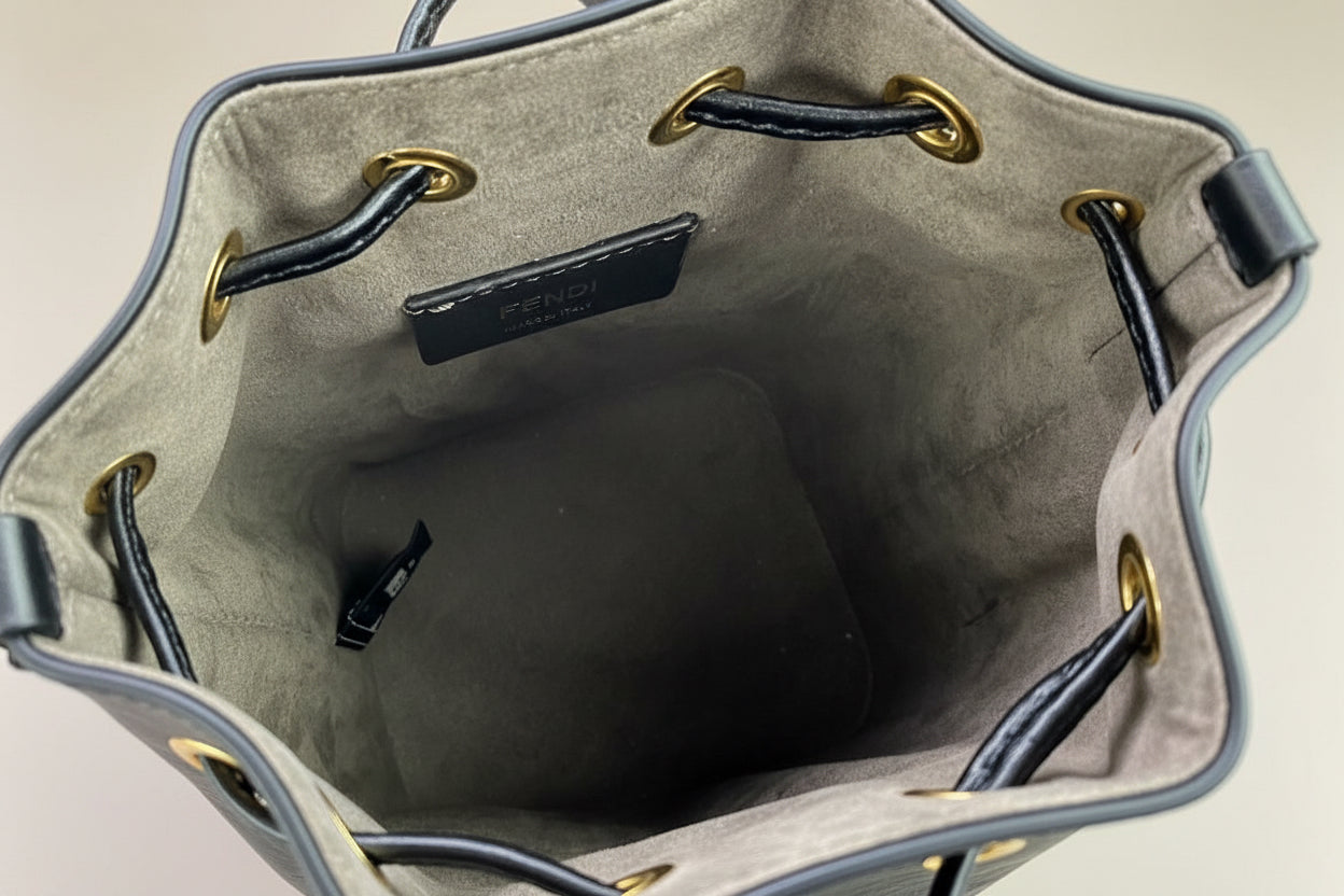 FENDI Mini Mon Trésor Bucket Bag – Brown FF Embossed Leather – 2-Way Drawstring – 100% Authentic Previously myOwned | Excellent Condition