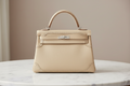 Hermès Kelly 32 Gillies Veau Swift Argile Leather Silver Hardware Previously Owned Authentic