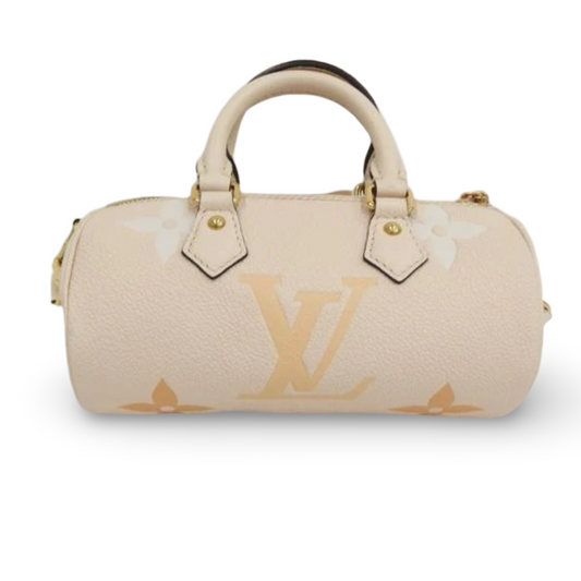 Louis Vuitton Papillon BB ivory beige grained leather with oversized Monogram print, rolled top handles, and a structured barrel silhouette. Previously Owned | Good Condition | L’LUXE Authentics
