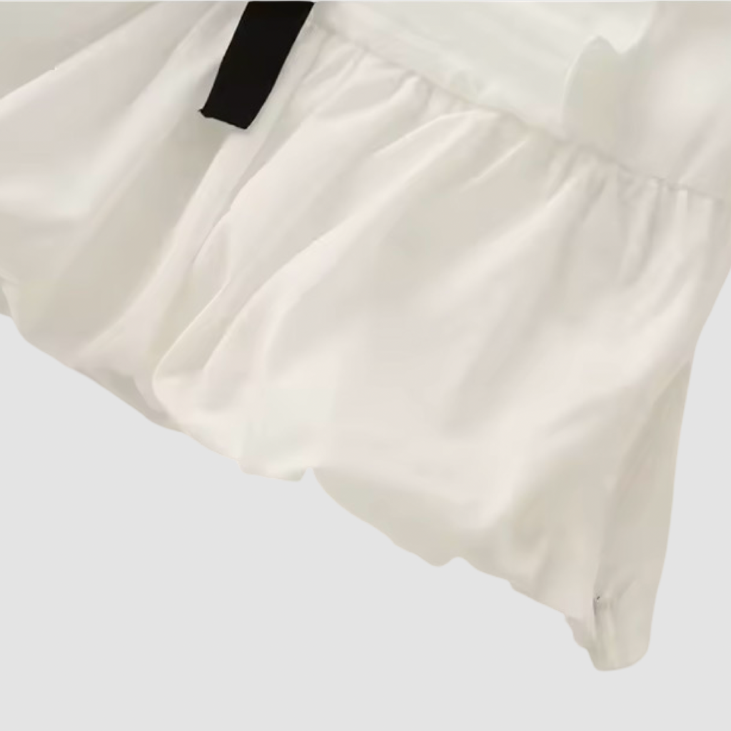Sleeveless Pleated Peplum Top Bow Detail