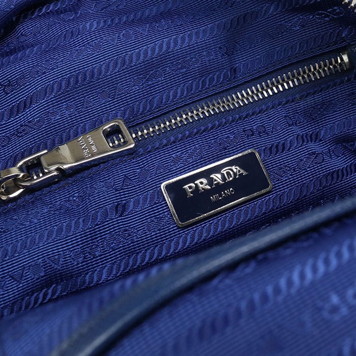PRADA – – Mini Daypack – Backpack 1BZ066 Designed by Miuccia Prada – 2010s – 100% Authentic Pre - Owned Item No.: usdpr86616011 - LLUXE.CA
