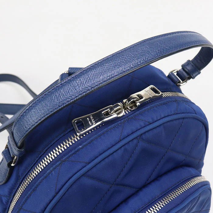 PRADA – – Mini Daypack – Backpack 1BZ066 Designed by Miuccia Prada – 2010s – 100% Authentic Pre - Owned Item No.: usdpr86616011 - LLUXE.CA